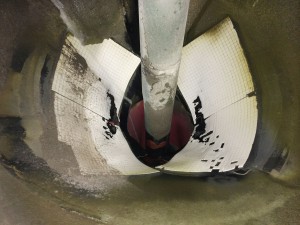 Showing the worn ceramic  lining trialled inside the wok.