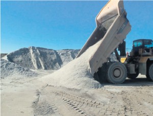 Dumping a load of material at safe distance back from the crest